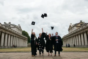 Graduates tossing their mortar boards into the air. Graduation Ceremony. Devon Photographer - Robb Webb