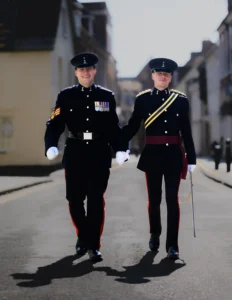 Two Royal Signals Officers, in dress uniform walk hand in hand through the back streets of Poole in Dorset having just been married at the Guildhall Poole, Dorset.