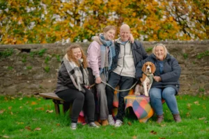 Family portrait with their dog photographed outdoors in North Devon by Robb Webb Photography